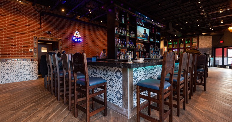 Interior space, bar with upholstered bar chairs