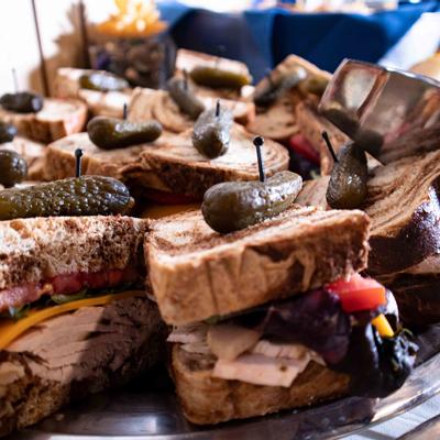Sandwiches with pickles on top