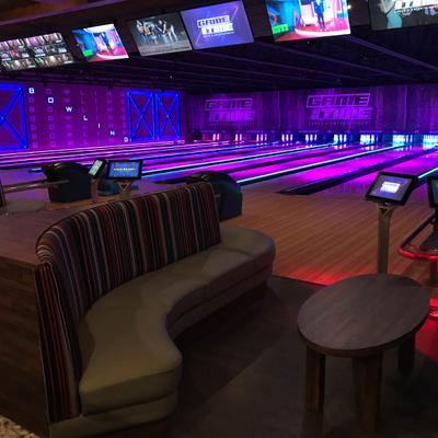 The seating area next to bowling alleys.