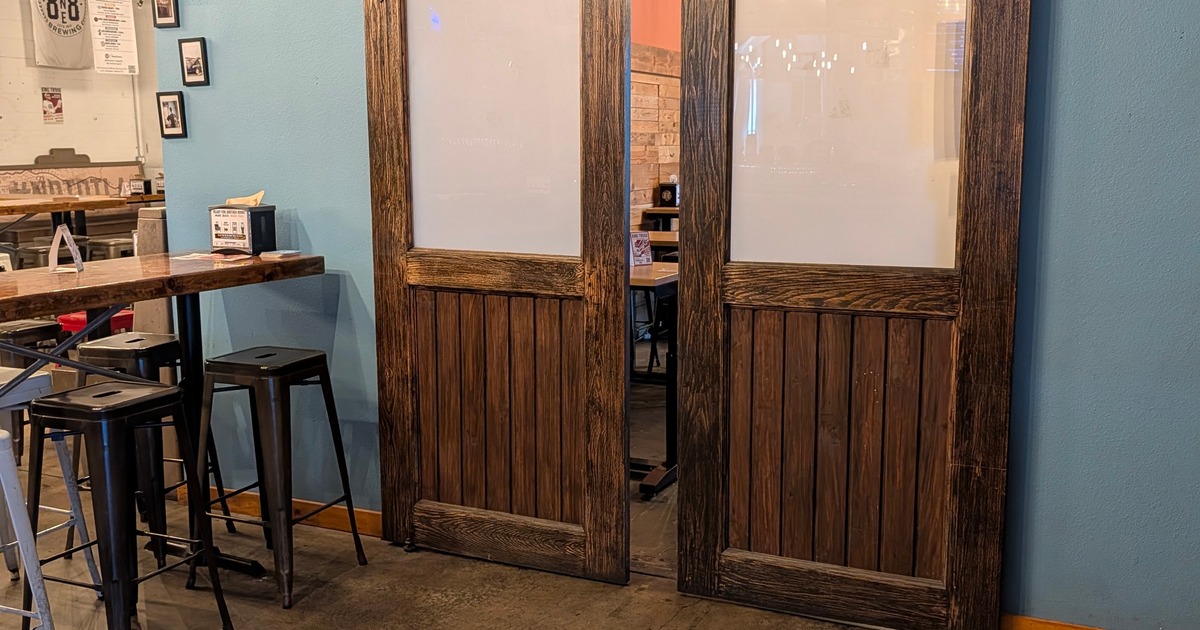Craft brewery features rustic barn doors leading to a private room for parties, meetings, and special events.