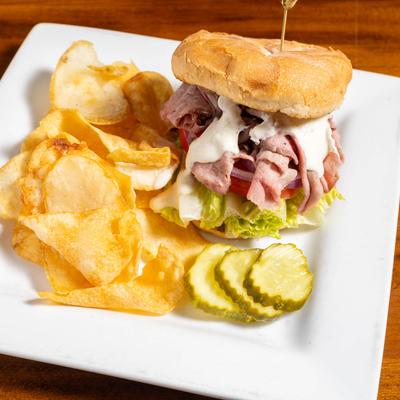 Roast beef sandwich and potato chips.