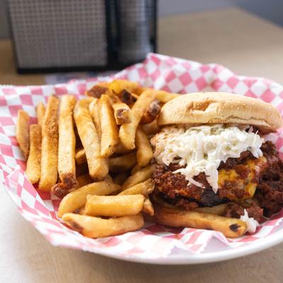 Chili Billy burger with melted cheese and fries.