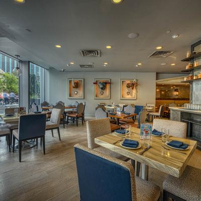 Tables and chairs inside of dining hall.