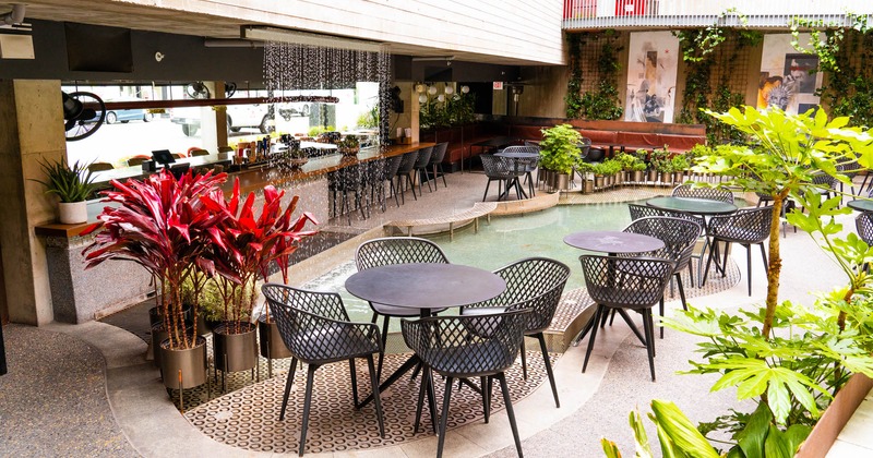 Exterior, seating and plants by the fountain