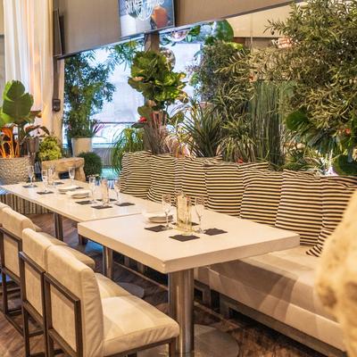 Interior, seating area, banquette bench with tables and chairs, ready for guests