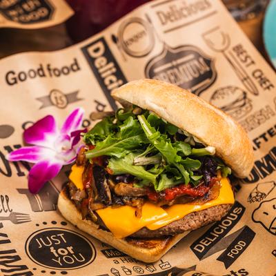 Blueprint Vegan Burger with vegan cheese, mushrooms and arugula.