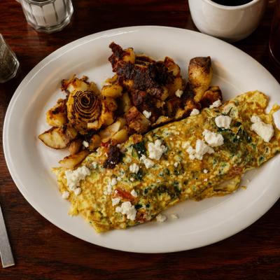 Athenian Omelette topped with crumbled feta and served with home fries.