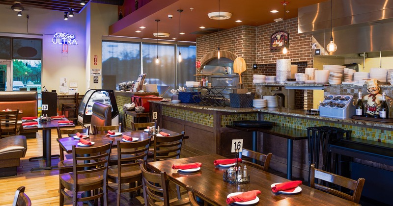 Tables marked with numbers, set with tableware