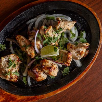 Grilled chicken, with herbs, onions, and lime.