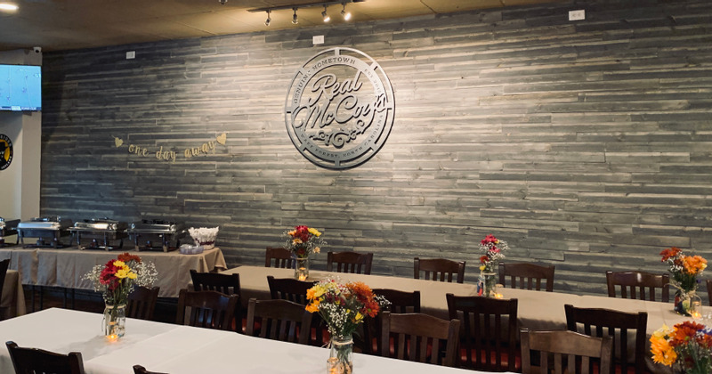 Buffet room with floral decoration on tables, ready to receive customers