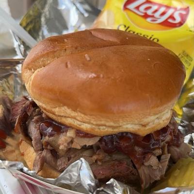 Sliced Brisket Sandwich on a toasted buttery bun.