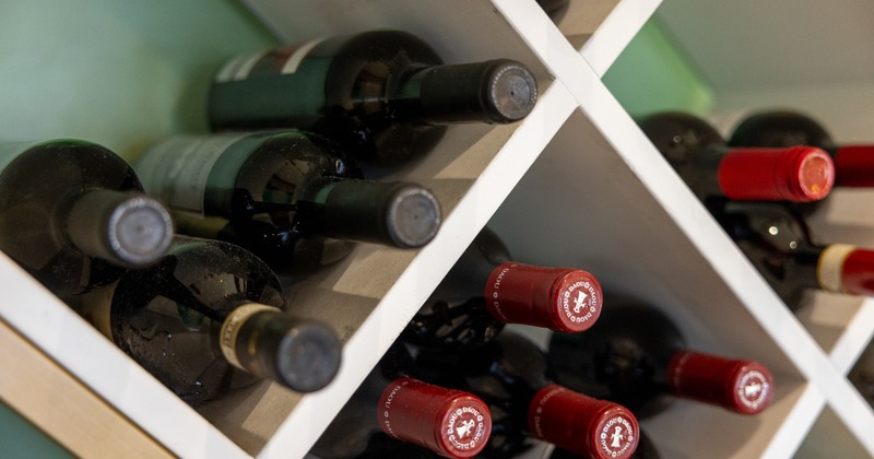 Wine rack, placed bottles, close up