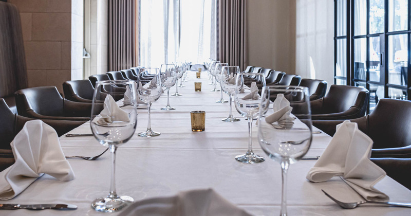 Table set with tableware and wine glasses
