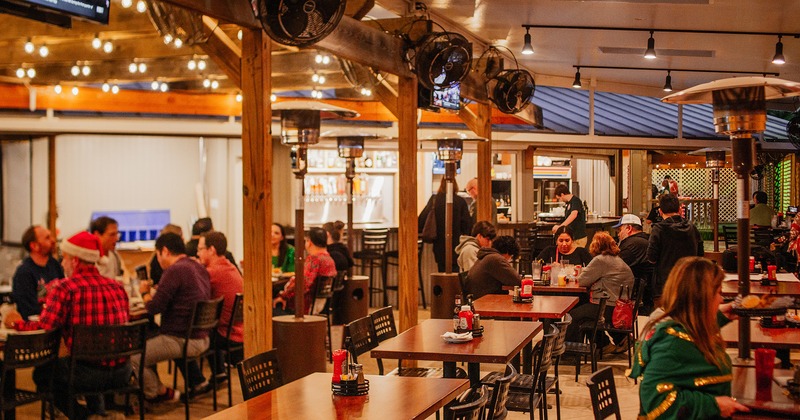 Interior space, dining area, guests chatting and enjoying their food and drinks