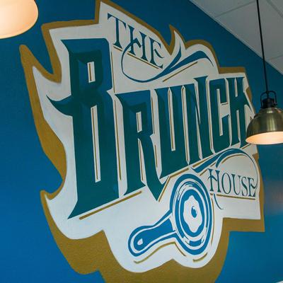 The Brunch House trademark on a wall inside.