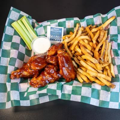 BBQ wings paired with fries, celery sticks and ranch.
