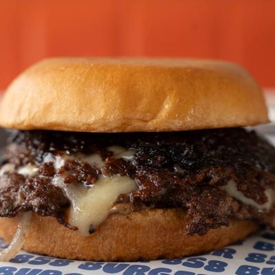 Smash burger with white cheddar cheese and grilled onions.