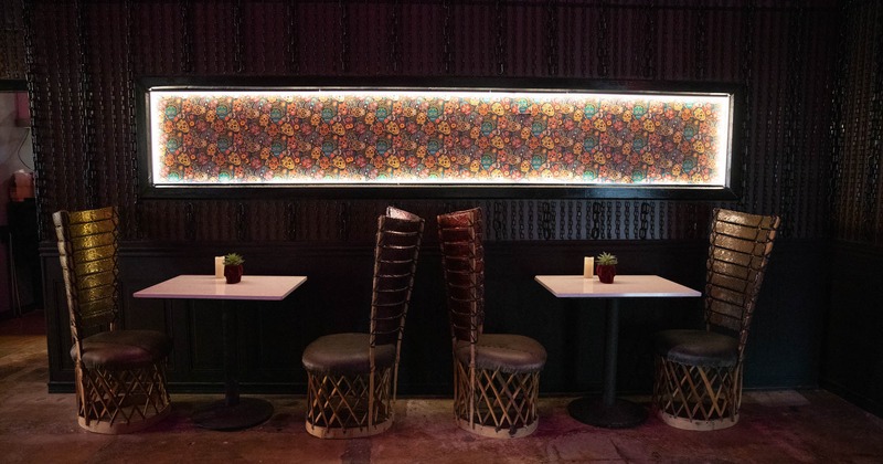 Two tables by the wall with luminous decor