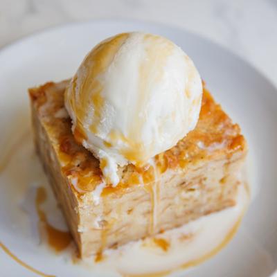 White Chocolate Bread Pudding topped with vanilla bean ice cream