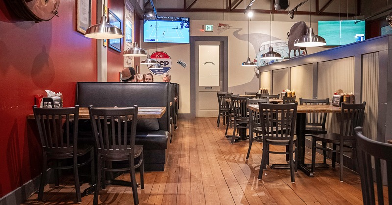 Interior space, dining area with dining tables and chairs and dining booths