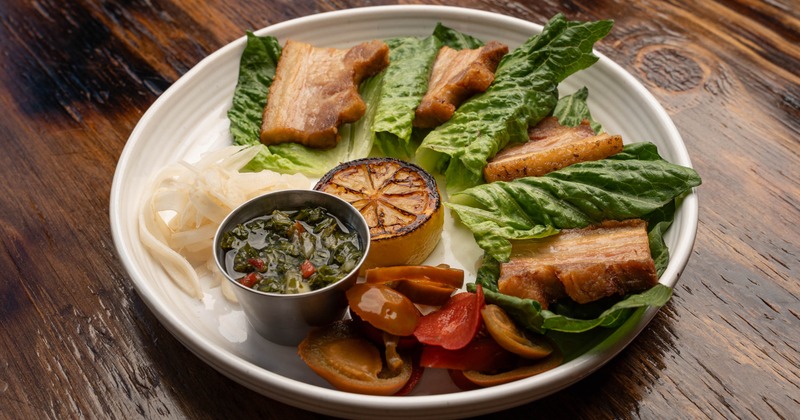 Pork belly lettuce wraps with salad and dipping sauce