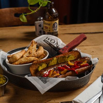 A served bratwurst sando.