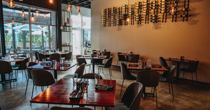 Interior, dining tables and chairs ready for guests