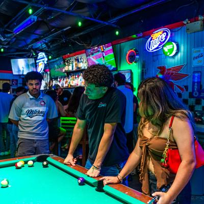 Guests playing pool.