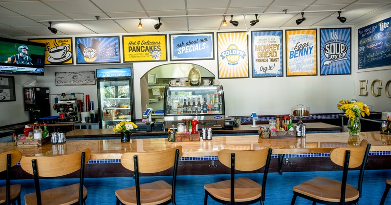 Bar, bar stools, coffe machine behind