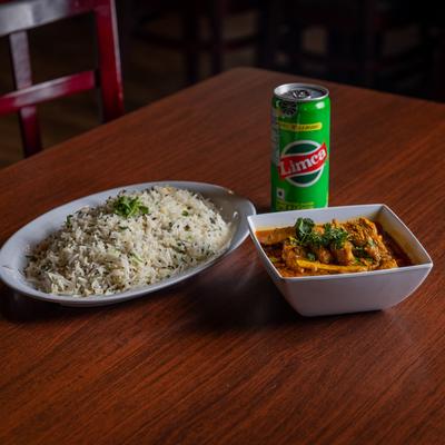 Tawa Chicken, served with rice, and Limca soda.