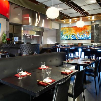 Inside the restaurant, dining seating arrangement, tables set with tableware.