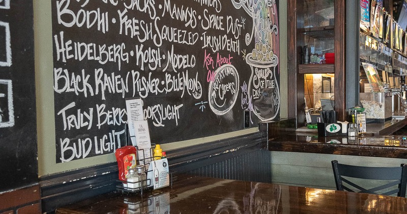 Interior, table with stools ready for guests
