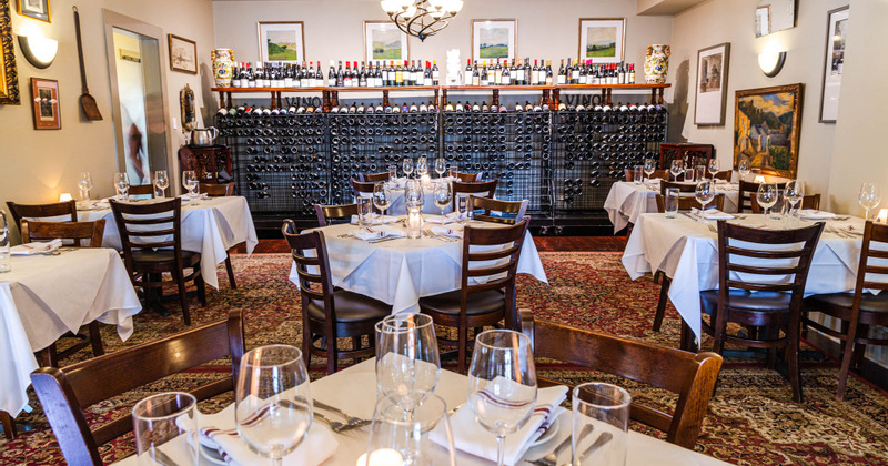 Interior, dining area and a wine rack in the back