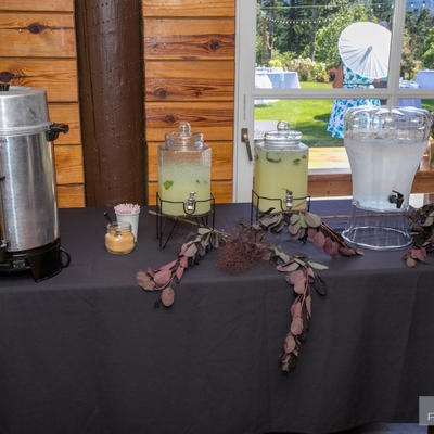 Coffee machine,bottles of lemonade and a bottle of water