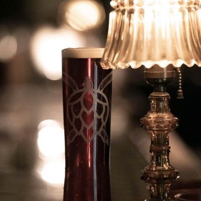 Interior, craft beer served next to a table lamp