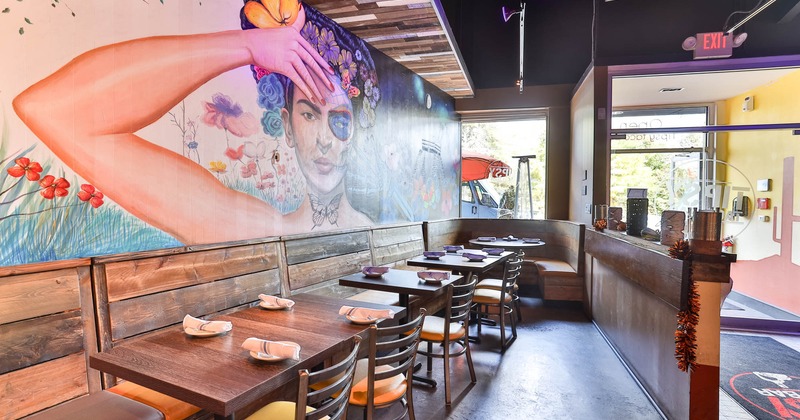 Interior, tables, chairs and wooden benches with leather cushion