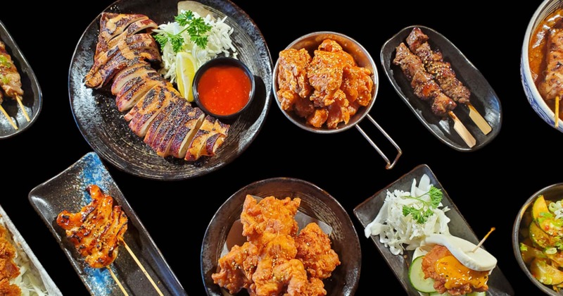 A variety of dishes with a focus on different types of skewers and fried items