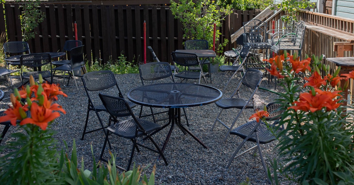 Exterior seating area with chairs and tables