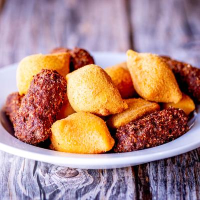 Brazilian salty deep fried snacks on a plate.