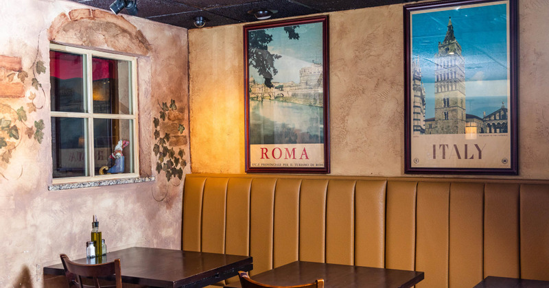 Interior, restaurant booth and decorative pictures on the wall