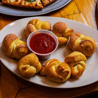 Garlic knots with marinara sauce.