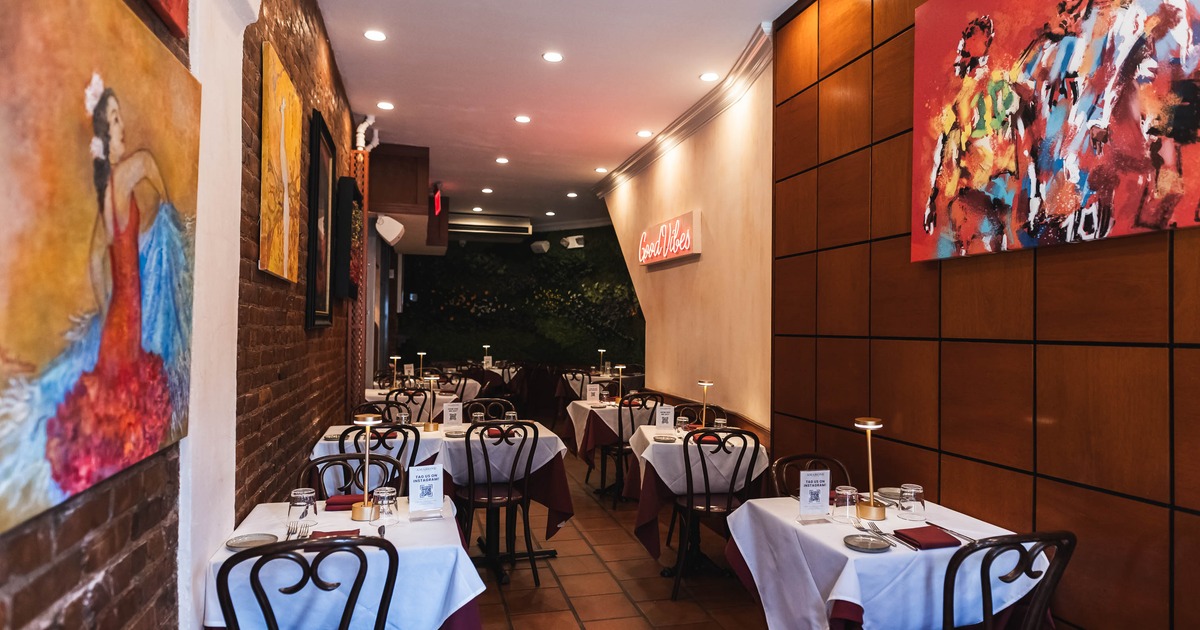 Cozy restaurant interior with white tablecloths on tables