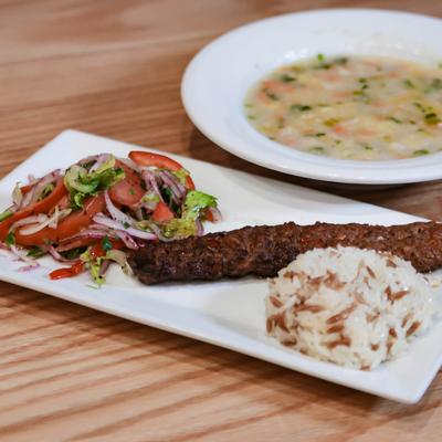 Beef with a salad and rice.