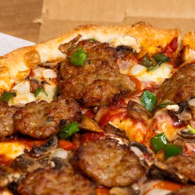 Deluxe pizza, close up.