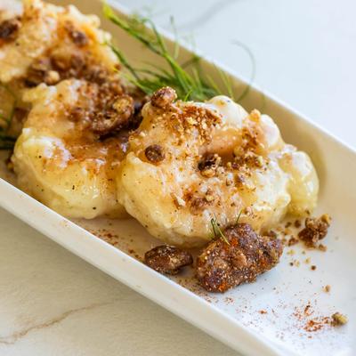 A close up of a plate with honey glazed shrimp