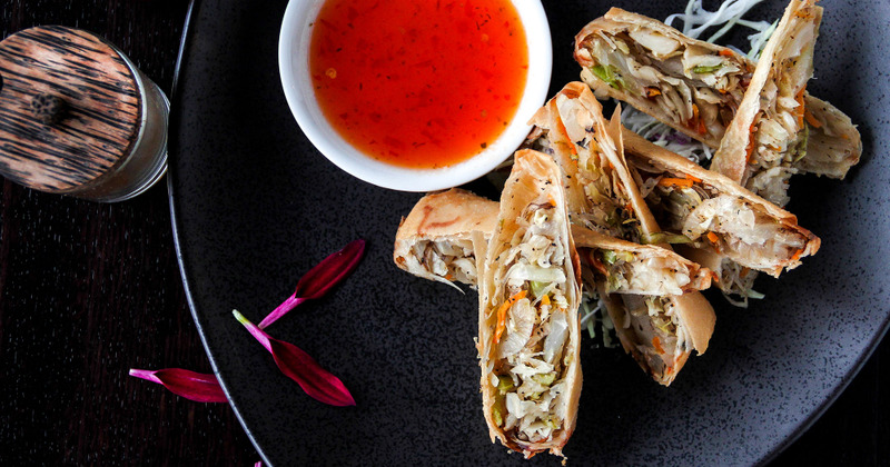 Spring rolls and a red sauce dip
