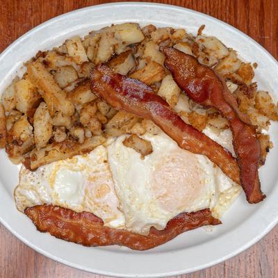 Fried eggs, turkey bacon, and fried potatoes.