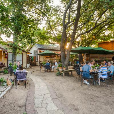 Exterior, guests sitting in the patio