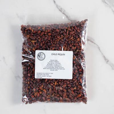 Bag of dried Chile Pequin peppers.
