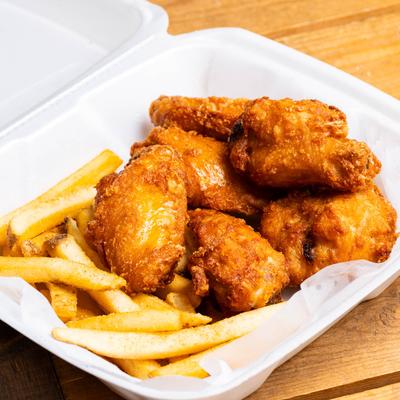 Chicken wings and fries.